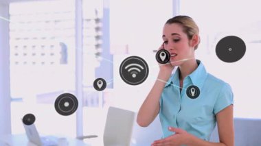 Animation of network of digital icons against caucasian businesswoman talking on smartphone. Global networking and business technology concept