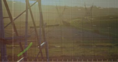Animation of financial data processing with green line over electricity pylons. Global environment, business, finances, computing and data processing concept digitally generated video.