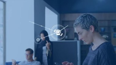 Animation of connected icons over short haired caucasian woman using cellphone in office. Digital composite, multiple exposure, report, business, communication and technology concept.