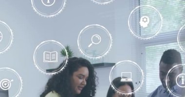 Animation of digital icons over diverse business people in office. Global business, finances, computing and data processing concept digitally generated video.