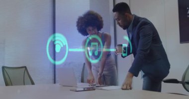 Animation of financial data processing and icons over diverse business people. Global business, finances, computing and data processing concept digitally generated video.