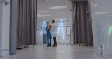 Animation of cardiograph over diverse doctors working at hospital. Medicine, healthcare and digital interface concept concept digitally generated video.