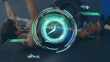 Animation of data processing over diverse people exercising in gym. Global sports, science, computing, digital interface and data processing concept digitally generated video.