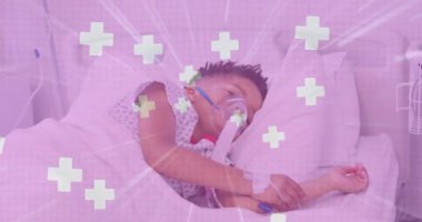Animation of crosses and light trails over african american boy wearing oxygen mask at hospital. Medicine, healthcare and digital interface concept concept digitally generated video.