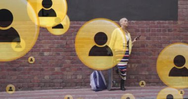 Animation of social media icons over biracial woman using smartphone. Global social media and digital interface concept digitally generated video.