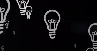 Animation of multiple light bulb icons floating against blue light spot on black background. Business technology concept