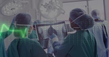 Animation of cardiograph over diverse surgeons working at hospital. Medicine, healthcare and digital interface concept concept digitally generated video.