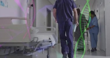 Animation of dna strand and connections over diverse doctor and patient at hospital. Medicine, healthcare and digital interface concept concept digitally generated video.