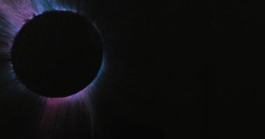 Video of multi coloured powders with copy space and circle on black background. Holi festival, hindu tradition and celebration concept