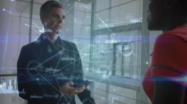 Animation of networks of connections with icons over diverse business people. Global business, finances, computing and data processing concept digitally generated video.