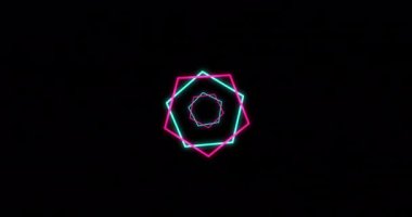 Animation of green and pink neon hexagons on black background. Neon, light and movement concept digitally generated video.