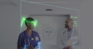 Animation of cardiograph over diverse doctors working at hospital. Medicine, healthcare and digital interface concept concept digitally generated video.