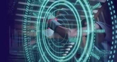 Animation of scope scanning and data processing over african american male boxer punching. Global sport and digital interface concept digitally generated video.