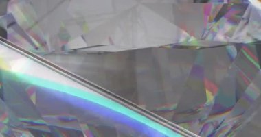 Animation of clear shiny prism moving over light spots. Abstract background and pattern concept digitally generated video.