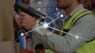 Animation of network of connections against caucasian male worker scanning stock at warehouse. Global networking and logistics business technology concept