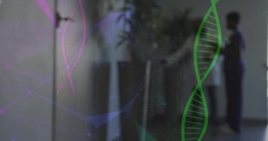 Animation of dna strand and connections over diverse doctors working at hospital. Medicine, healthcare and digital interface concept concept digitally generated video.