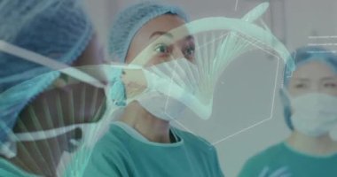 Animation of dna strand and chemical formula over diverse surgeons working at hospital. Medicine, healthcare and digital interface concept concept digitally generated video.