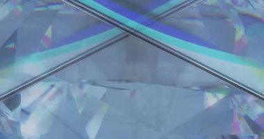 Animation of clear shiny prism moving over light spots. Abstract background and pattern concept digitally generated video.