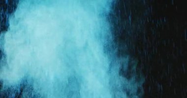 Video of blue coloured powders with copy space on black background. Holi festival, hindu tradition and celebration concept