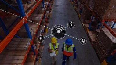 Animation of network of connections with icons over african american man working in warehouse. Global shipping, business, finances, computing and data processing concept digitally generated video.