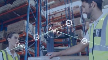 Animation of network of connections with icons over man and woman working in warehouse. Global shipping, business, finances, computing and data processing concept digitally generated video.