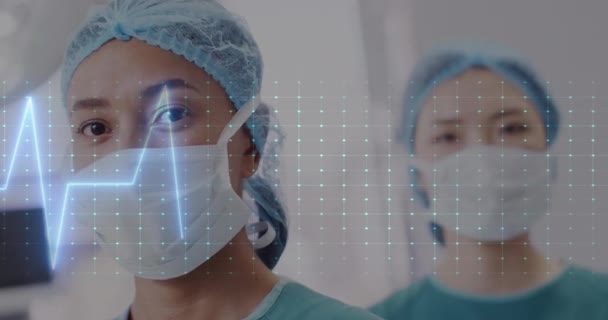 Animation Cardiograph Diverse Surgeons Working Hospital Medicine Healthcare Digital Interface — Stock Video