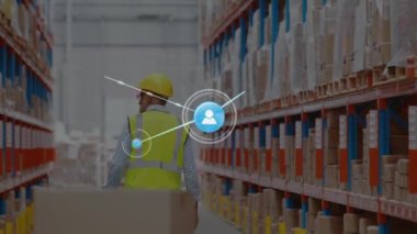 Animation of network of icons over rear view of caucasian male worker pulling a pallet at warehouse. Global networking and transportation business concept