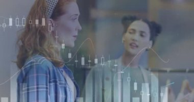 Animation of data processing over two diverse female fashion designers discussing at studio. Creative business technology concept