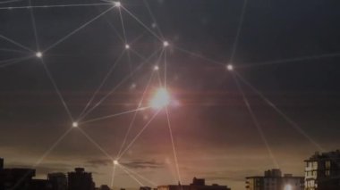 Animation of glowing network of connections against aerial view of cityscape. Global networking and business technology concept