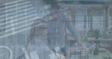 Animation of data processing over caucasian man and woman discussing over laptop at office. Business data technology concept