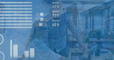 Animation of data processing over caucasian man and woman discussing over laptop at office. Business data technology concept