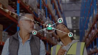 Animation of profiles icons over diverse female worker and male supervisor discussing at warehouse. Global networking and transportation business technology concept