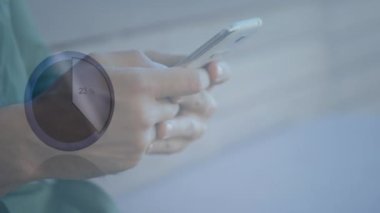Animation of statistical data processing against mid section of a man using smartphone. Business data technology concept