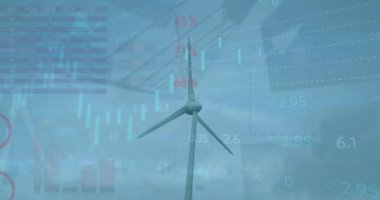 Animation of statistical and stock market data processing against spinning windmill. Global economy and renewable energy technology concept