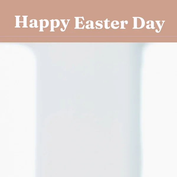 Composition of happy easter day text on white blurred background with copy space. Easter, tradition and celebration concept digitally generated image.
