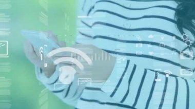 Animation of data processing with icons over caucasian woman using smartphone on green background. Global technology, computing and digital interface concept digitally generated video.