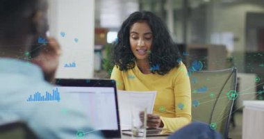 Animation of data processing over diverse business people in office. Global business and digital interface concept digitally generated video.