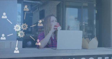 Animation of network of connections with icons over man using laptop. Global networks, business, finance, computing and data processing concept digitally generated video.