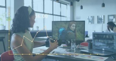 Animation of data processing over diverse business people working at office. Global business and digital interface concept digitally generated video.