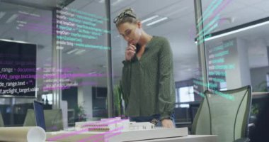 Animation of data processing over caucasian businesswoman working at office. Global business and digital interface concept digitally generated video.