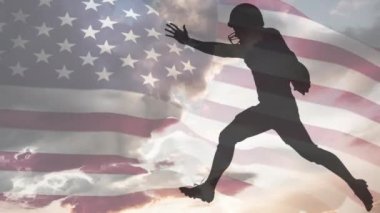 Animation of american football players silhouettes over flag of united states of america. American sports, patriotism and tradition concept digitally generated video.