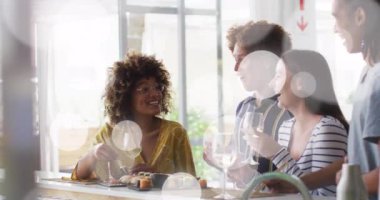Animation of white spot lights over diverse friends having drink in bar. Leisure, free time and celebration concept digitally generated video.