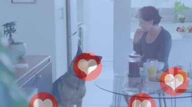 Animation of heart emojis over happy caucasian woman with dog. Love, romance and celebration concept digitally generated video.