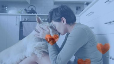 Animation of red heart icons over caucasian woman with pet dog. National love your pet day concept digitally generated video.