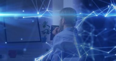 Animation of computing data processing over man using computer. Global science, business, finance, computing and data processing concept digitally generated video.