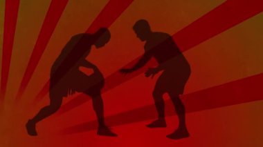 Animation of basketball players silhouettes over shapes on orange background. Sport, competition and movement concept digitally generated video.