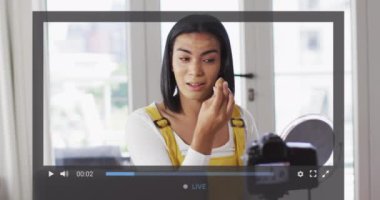 Animation of screen interface over biracial woman on makeup vlog. Global social media and online vlogging concept digitally generated video.