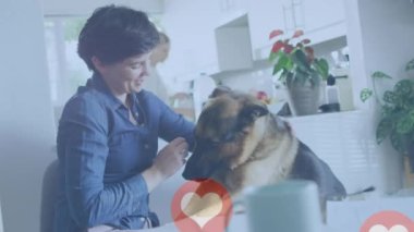 Animation of red heart icons over caucasian woman with pet dog. National love your pet day concept digitally generated video.
