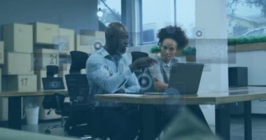 Animation of financial data processing over diverse business people. Global business, finances, computing and data processing concept digitally generated video.