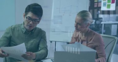 Animation of financial data processing over diverse business people. Global business, finances, computing and data processing concept digitally generated video.